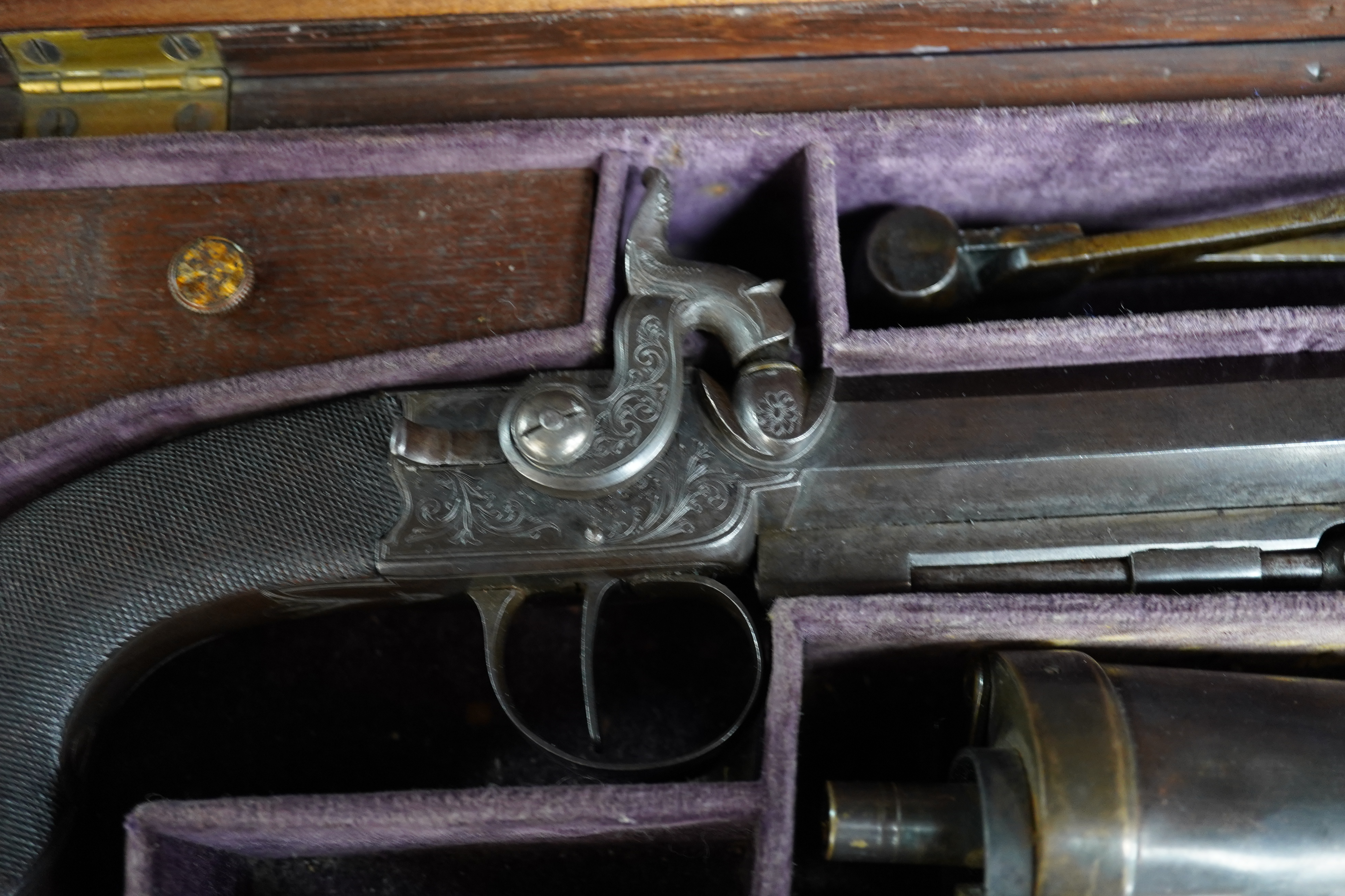 A pair of rosewood cased Blake & Co. London percussion cap travelling pistols, with octagonal barrels, engraved Blake & Co. London, Birmingham proof marks, side hammers, sliding safety bolts, swivel ramrods, foliate engr